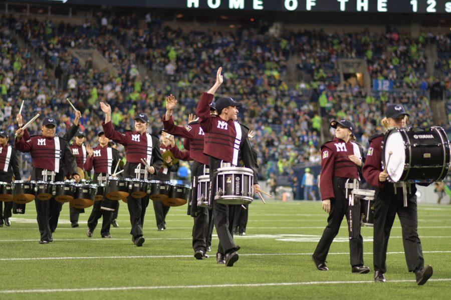 The drum line waves to the cheering crowd. Photo courtesy Joe Chen.