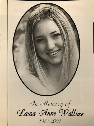 A portrait photo of Laura Wallace commemorates her life  