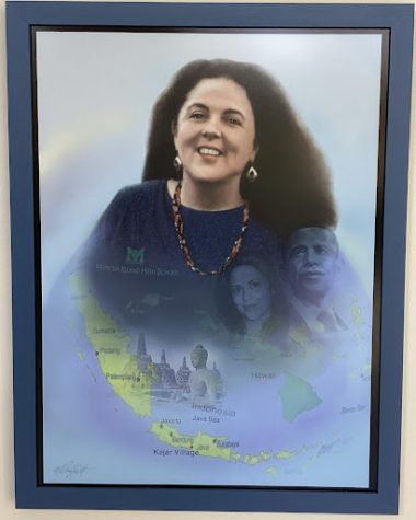 A portrait of Stanley Ann Dunham by Al Doggett hangs near the main office at MIHS.
According to Dr. Michelle Flowers-Taylor, this “portrait illustrates her roots on Mercer Island and key aspects of her unique life.”
