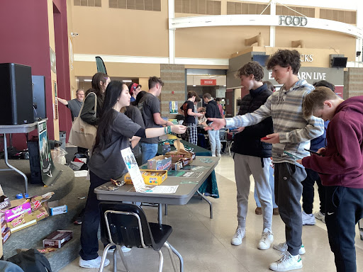 Island Space members handing out merchandise. 
