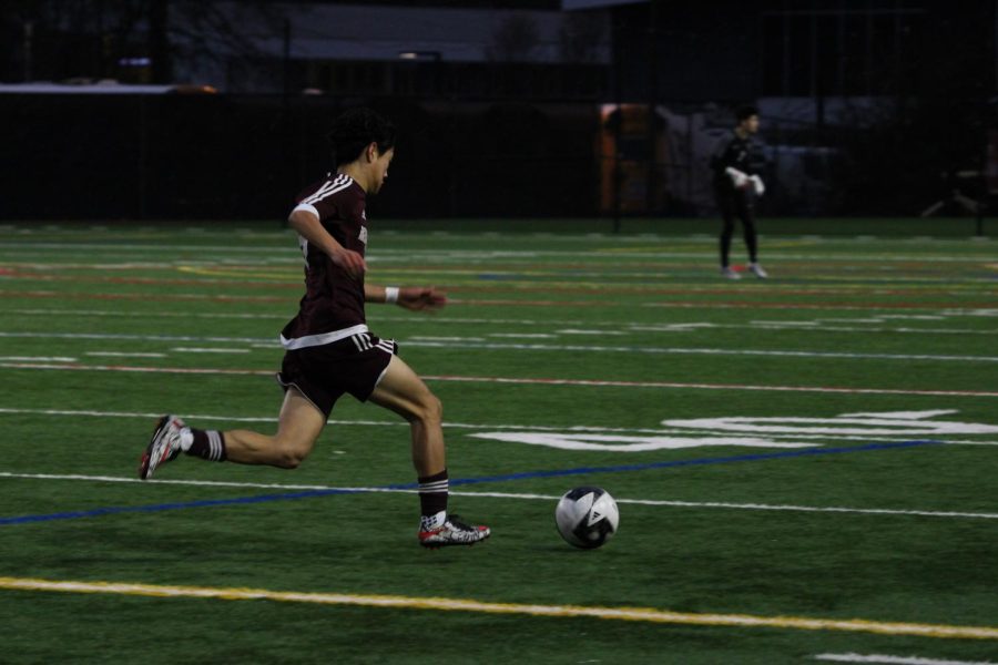 An MIHS player advances the ball across the field.