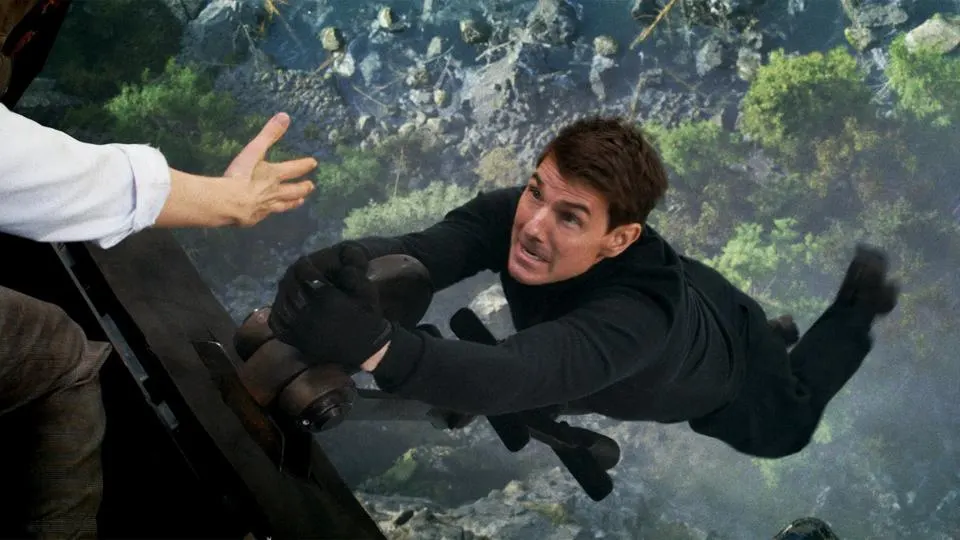 Ethan Hunt (Tom Cruise) hangs off a traincar during the final sequence.