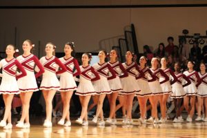The Drill Team performs during the Homecoming assembly.