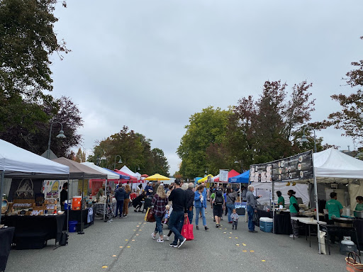 People walk around at the Mercer Island Farmers Market.