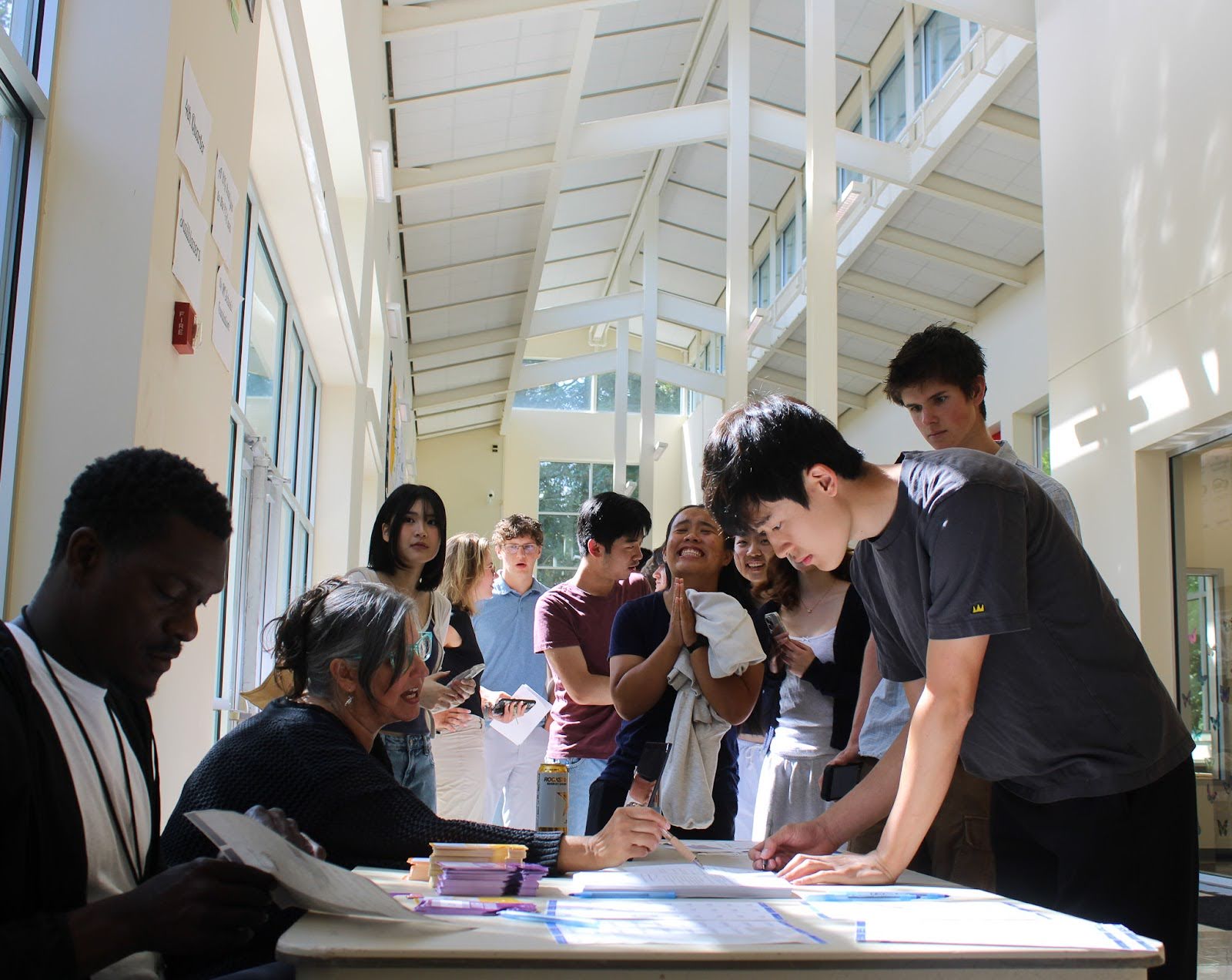 Students signing for their parking permit.